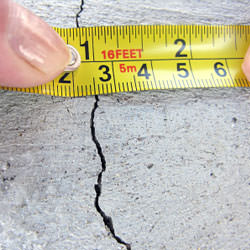 A crack in a poured concrete wall that's showing a normal crack during curing in Talladega