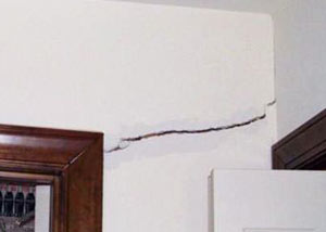 A large drywall crack in an interior wall in Tuscaloosa