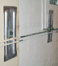 A foundation wall anchor system used to repair a basement wall in Daphne