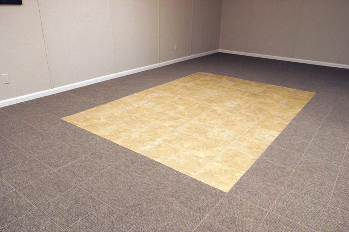 tiled and carpeted basement flooring installed in a Montgomery home